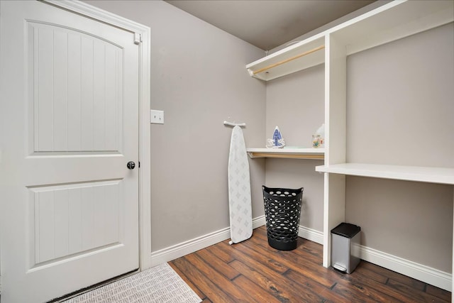 laundry room with dark wood-type flooring