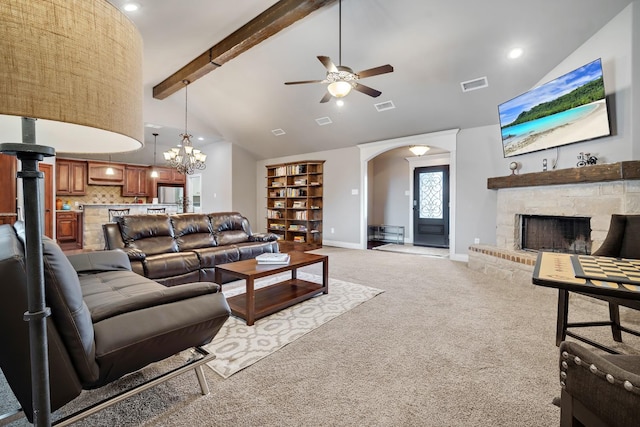 living room with ceiling fan, beam ceiling, high vaulted ceiling, a fireplace, and light carpet