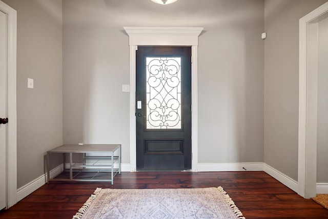 foyer entrance with dark hardwood / wood-style flooring and plenty of natural light