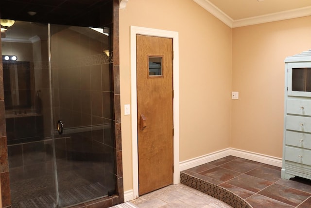 bathroom with baseboards, a stall shower, tile patterned flooring, and crown molding