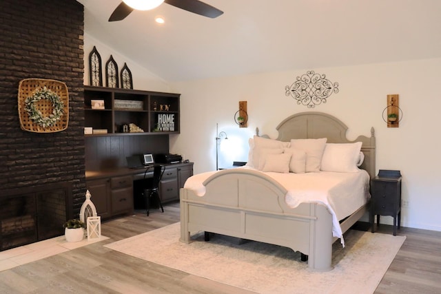 bedroom featuring lofted ceiling, recessed lighting, light wood-style flooring, and a ceiling fan