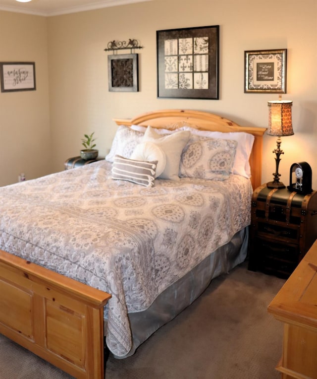 carpeted bedroom featuring ornamental molding