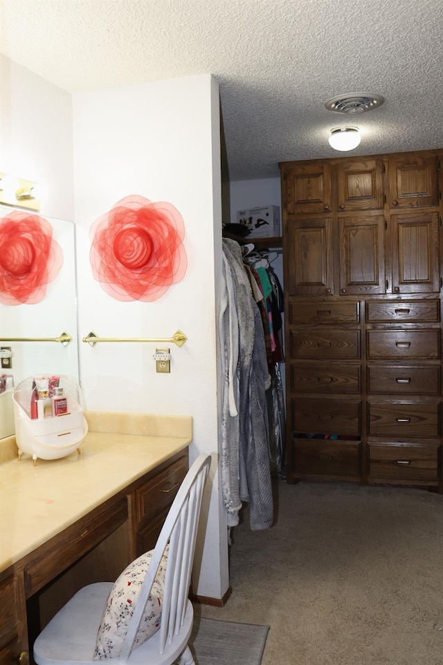 spacious closet with carpet flooring and visible vents