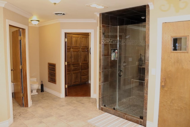 bathroom featuring a stall shower, visible vents, toilet, heating unit, and crown molding