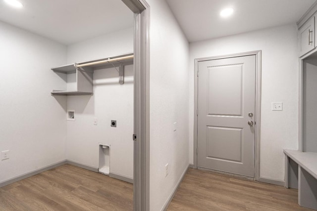 laundry area with hardwood / wood-style flooring, electric dryer hookup, and washer hookup