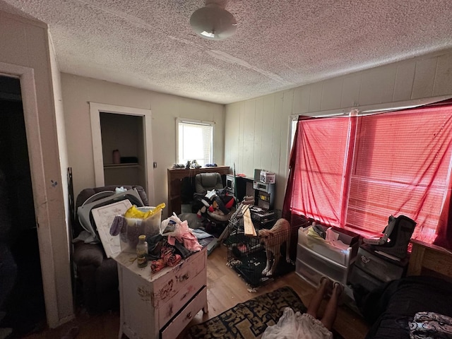 misc room featuring hardwood / wood-style floors and a textured ceiling