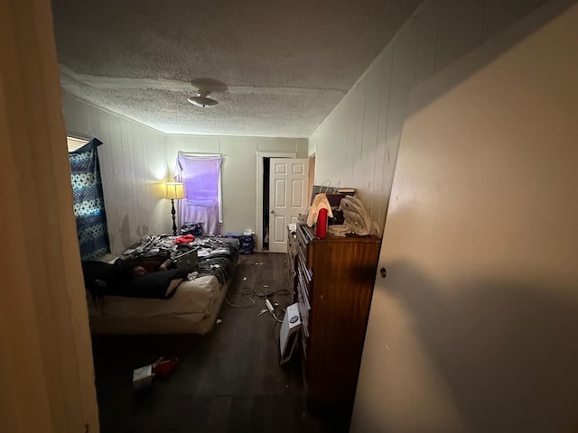 miscellaneous room with a textured ceiling