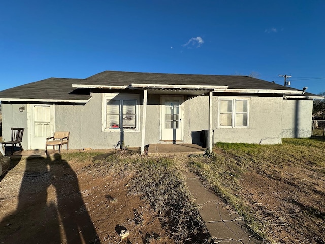 back of house with a patio