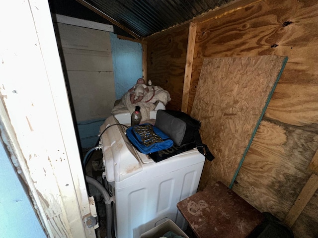 misc room with lofted ceiling and washer / clothes dryer