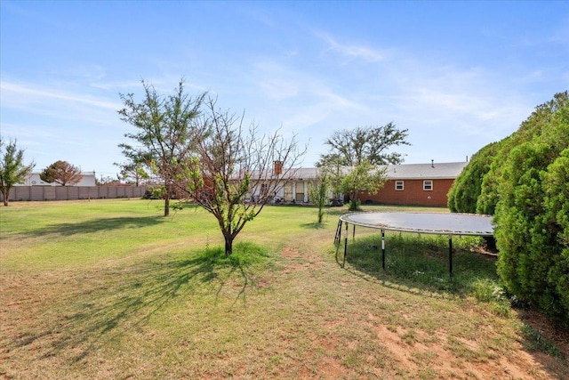 view of yard with a trampoline