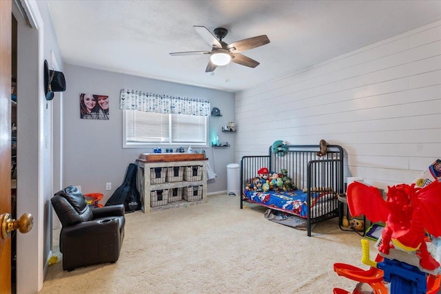 carpeted bedroom featuring ceiling fan