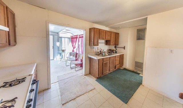 kitchen with white range with gas stovetop