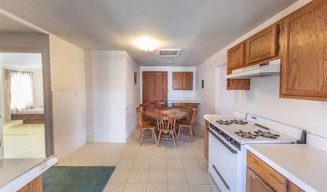 kitchen featuring white range with gas stovetop