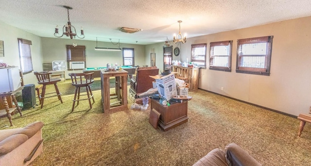 interior space with an inviting chandelier, carpet, and a textured ceiling