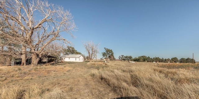 view of yard with a rural view