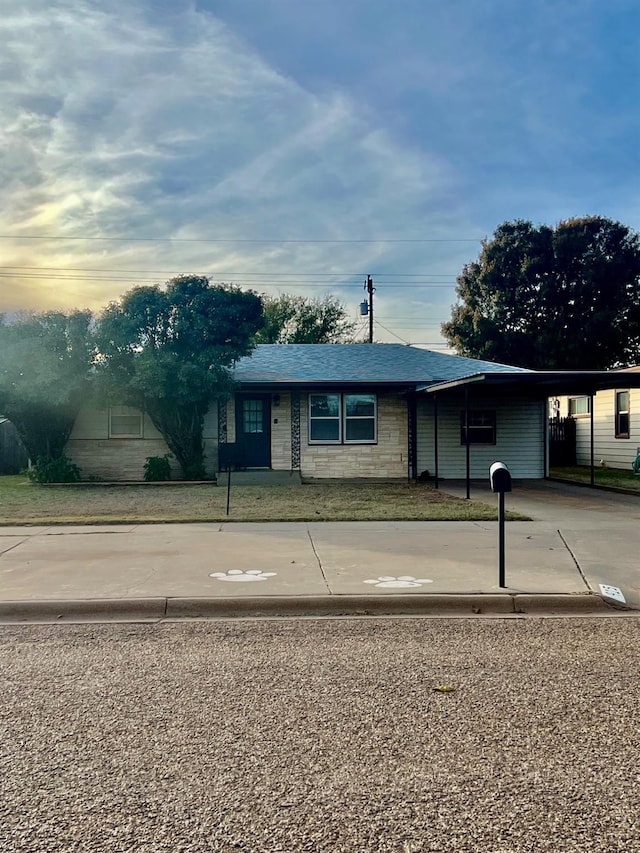 ranch-style house with a carport