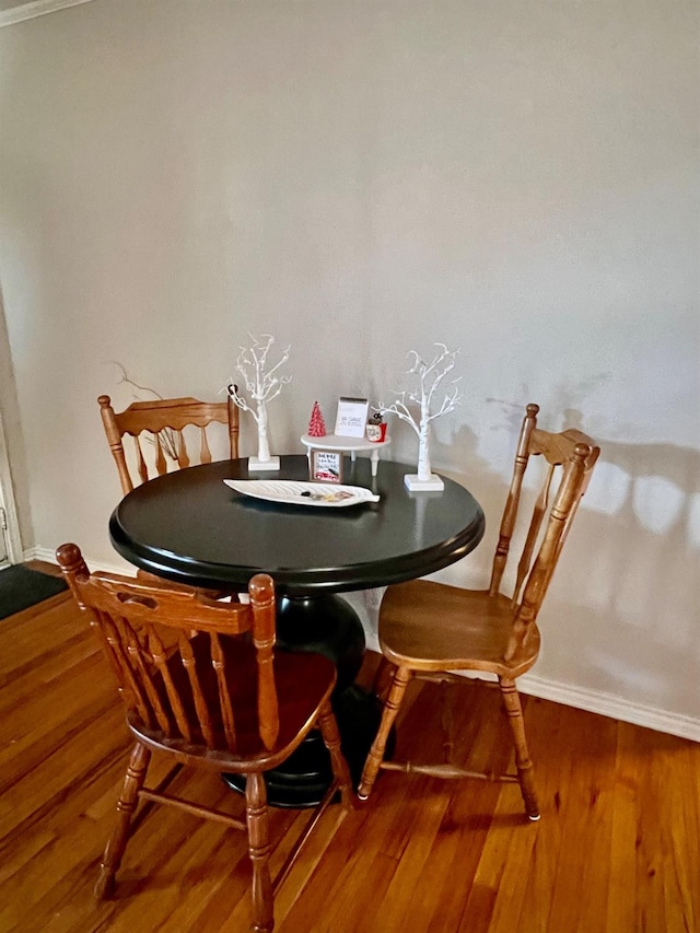 dining room with hardwood / wood-style floors