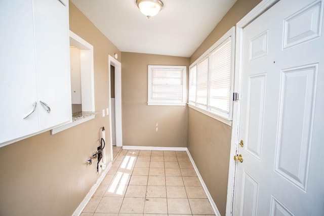 laundry room featuring light tile patterned floors