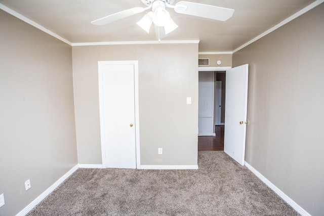 unfurnished bedroom featuring ceiling fan, light colored carpet, and ornamental molding