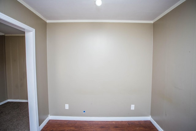 spare room with crown molding and hardwood / wood-style flooring