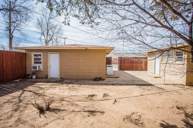 back of property featuring a patio and cooling unit