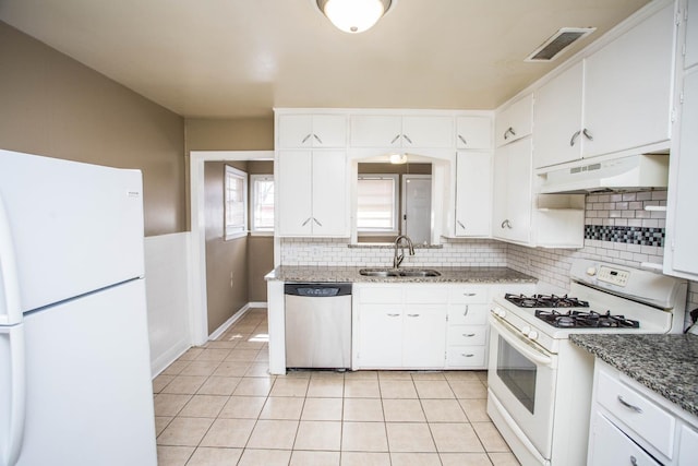 kitchen with white cabinetry, sink, and white appliances