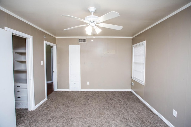 unfurnished bedroom with crown molding, ceiling fan, and carpet