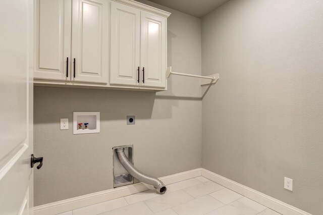 laundry area featuring hookup for a washing machine, cabinets, and hookup for an electric dryer