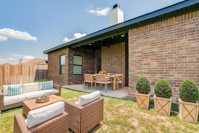 view of patio / terrace with ceiling fan and outdoor lounge area