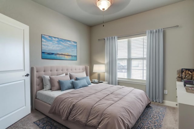 bedroom featuring light colored carpet and ceiling fan