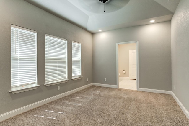 carpeted empty room with ceiling fan