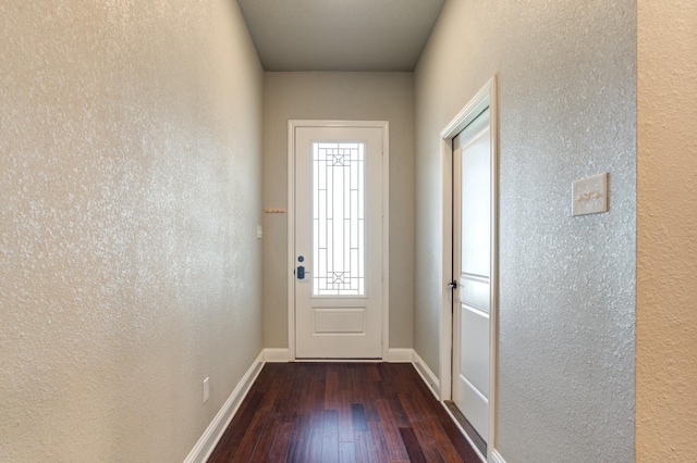 entryway with dark wood-type flooring