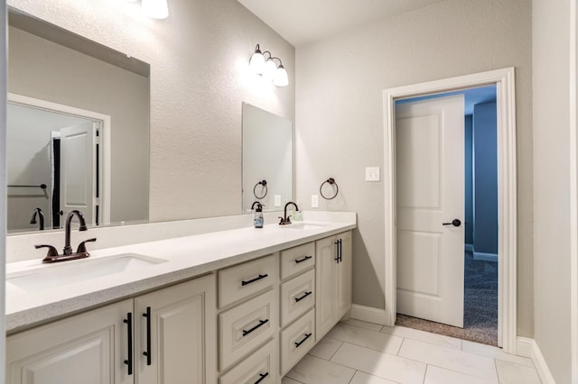 bathroom featuring vanity and tile patterned flooring