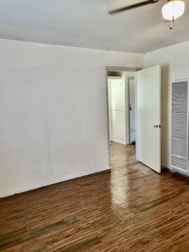 unfurnished room featuring dark hardwood / wood-style floors