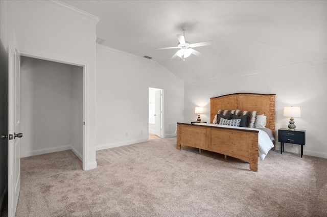 bedroom with lofted ceiling, crown molding, ceiling fan, and carpet