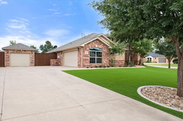 view of front of house featuring a garage and a front yard