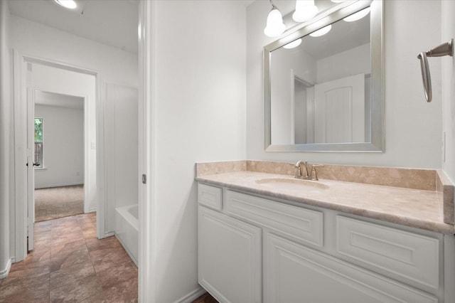 bathroom featuring vanity and a bathing tub