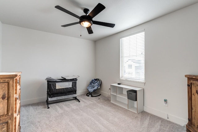 miscellaneous room with light colored carpet and ceiling fan