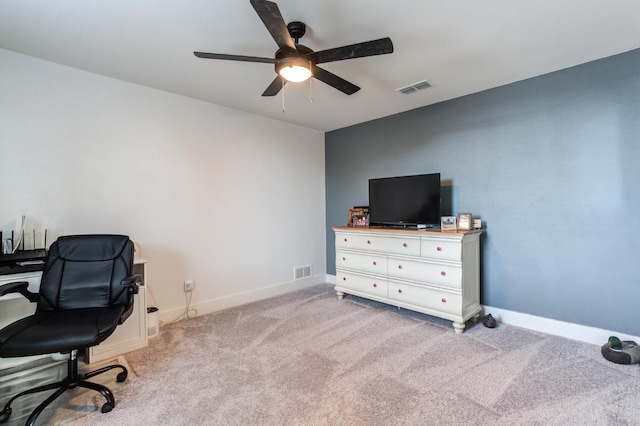 office featuring light carpet and ceiling fan