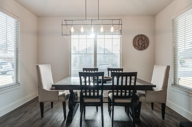 dining area with dark hardwood / wood-style floors