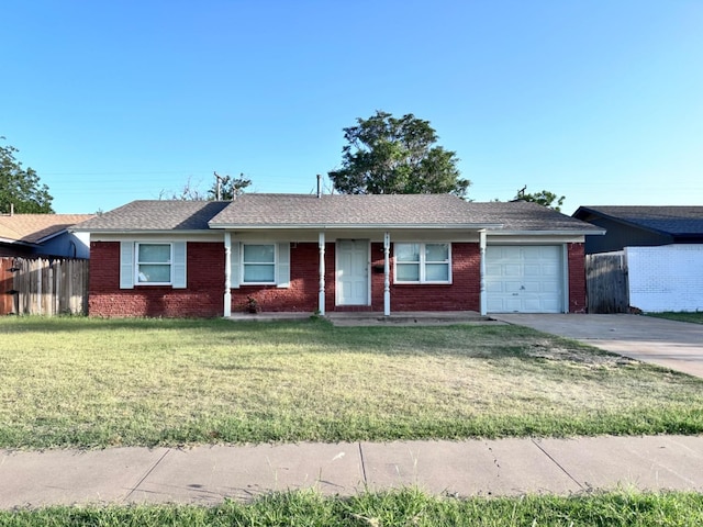 ranch-style house with a garage and a front lawn