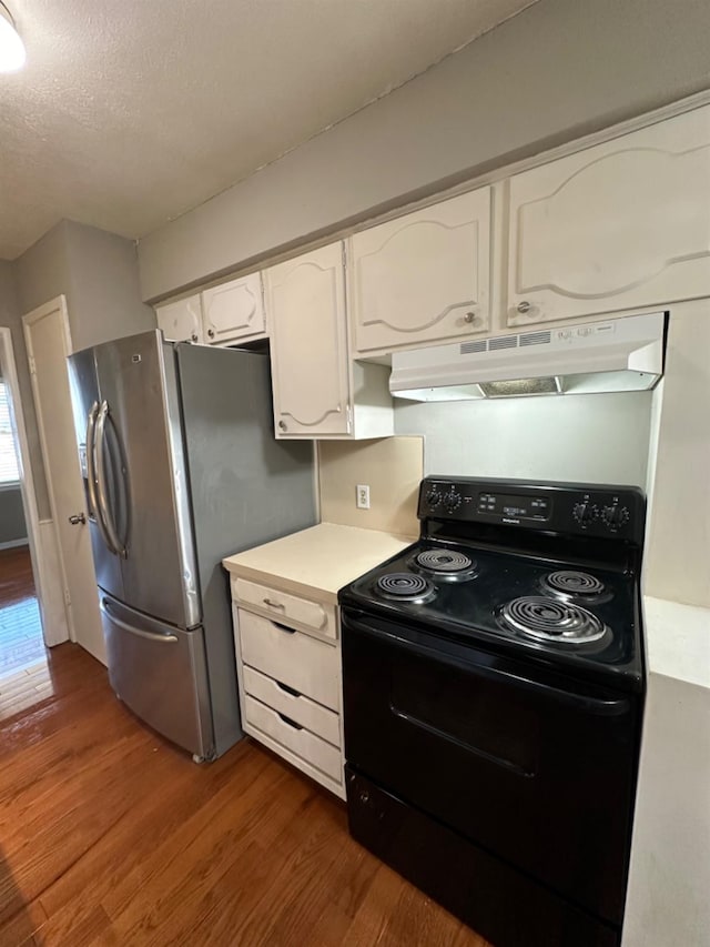 kitchen with dark hardwood / wood-style floors, white cabinets, stainless steel fridge with ice dispenser, a textured ceiling, and black / electric stove