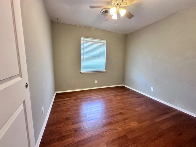 unfurnished room featuring ceiling fan and dark hardwood / wood-style flooring