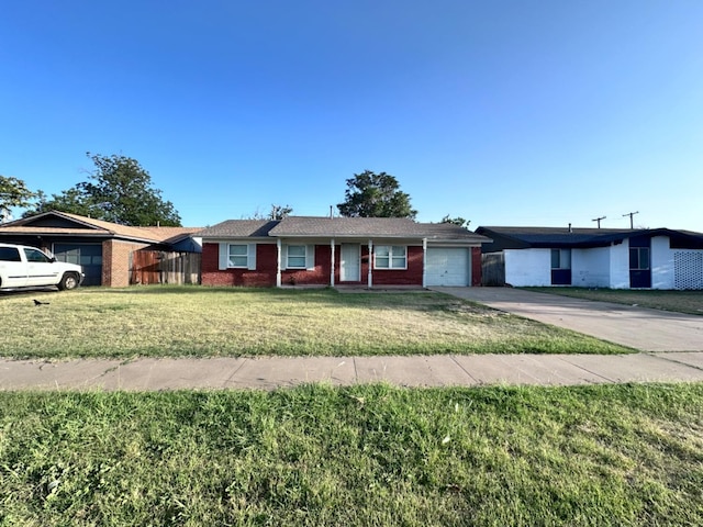 ranch-style home featuring a garage and a front lawn