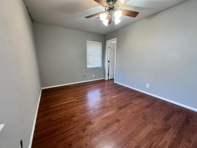 unfurnished room featuring dark hardwood / wood-style flooring and ceiling fan