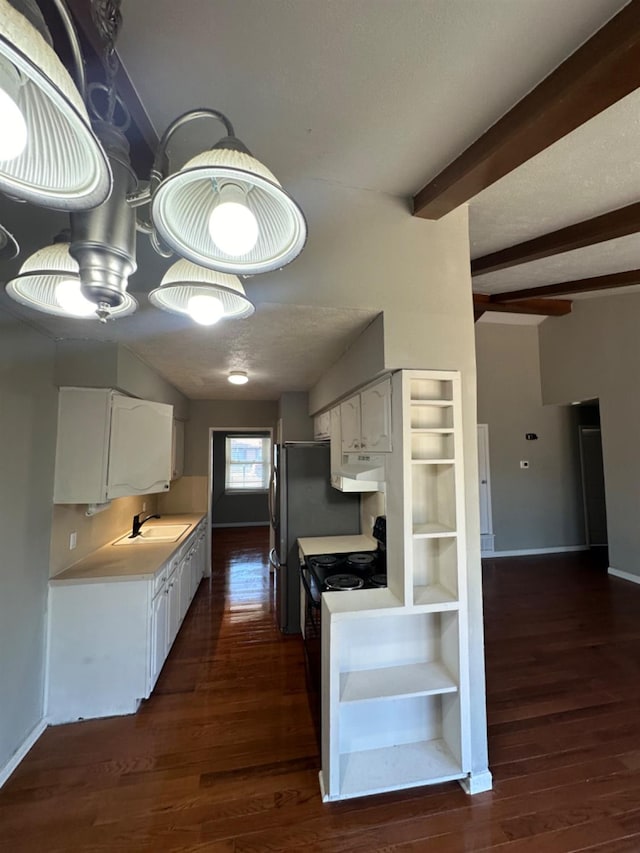 kitchen with white cabinetry, dark hardwood / wood-style flooring, sink, and beam ceiling