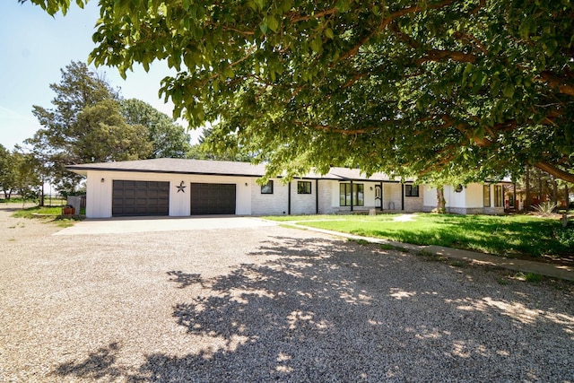 2911 US Highway 385, Littlefield, TX 79339 - view of front of house with a garage and a front lawn