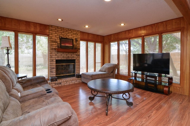 2911 US Highway 385, Littlefield, TX 79339 - living room with wooden walls and light wood-type flooring
