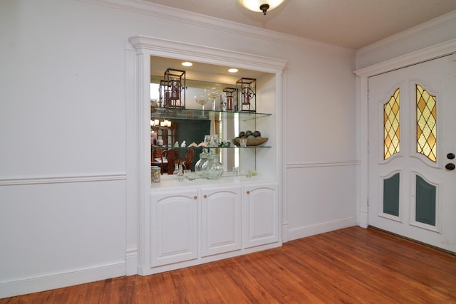 2911 US Highway 385, Littlefield, TX 79339 - bar with crown molding and wood-type flooring