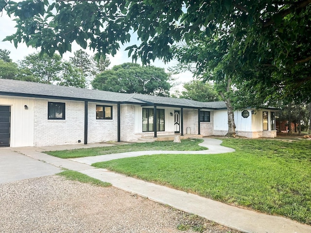 2911 US Highway 385, Littlefield, TX 79339 - single story home with a garage, a porch, and a front lawn